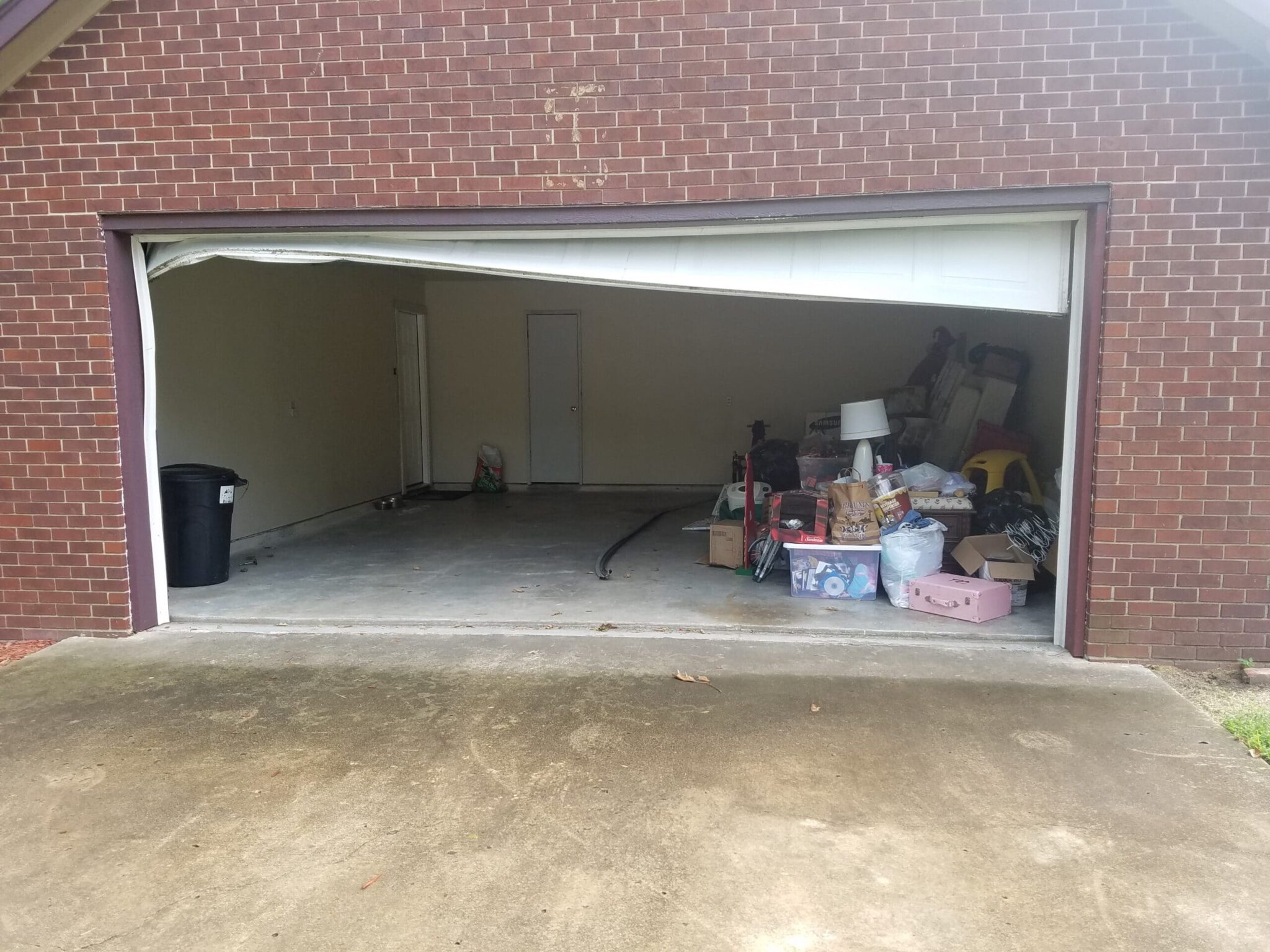 Double Car Garage Door That Had Been Backed Into (Before)